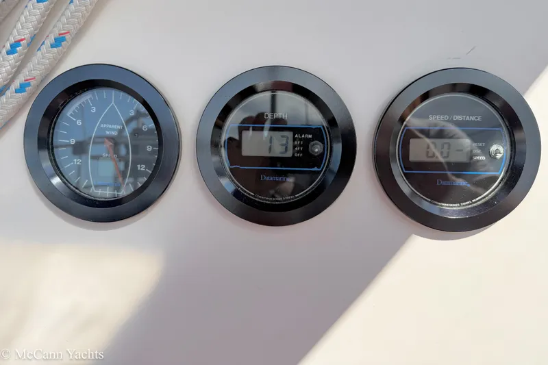 Slide: The Image of Instrument panel on 1989 Island Packet 31 yacht showing wind, depth, and speed gauges. - 50