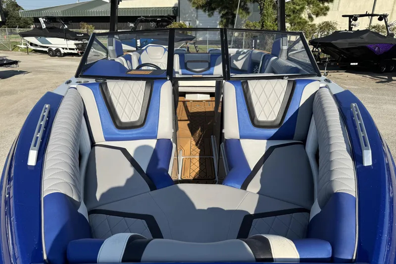 Slide: The Image of 2019 Tigé ZX5 boat interior with blue and gray seating, showcasing luxury design. - 4