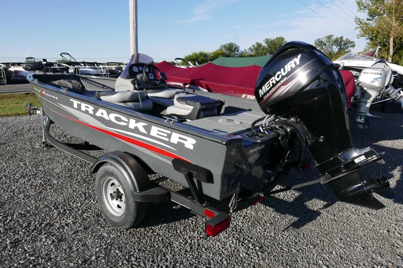 Slide: The Image of 2018 Tracker Super Guide V-16 boat with Mercury outboard motor on a trailer. - 3