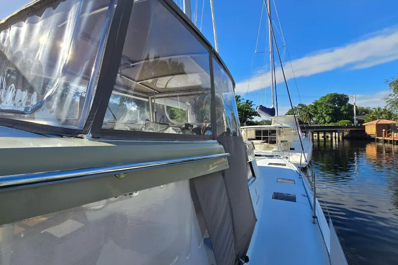 Slide: The Image of 2017 Fountaine Pajot Lucia 40 catamaran docked on a sunny day, showcasing sleek design. - 10