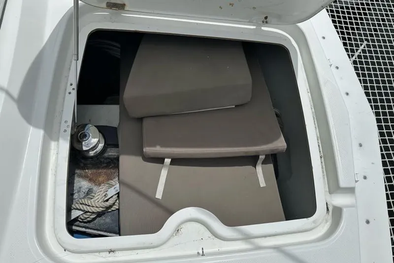 Slide: The Image of Storage compartment on 2017 Fountaine Pajot Lucia 40 catamaran with cushions and rope. - 16