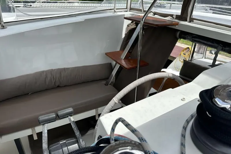 Slide: The Image of Interior view of 2017 Fountaine Pajot Lucia 40 catamaran cockpit with seating and steering wheel. - 21
