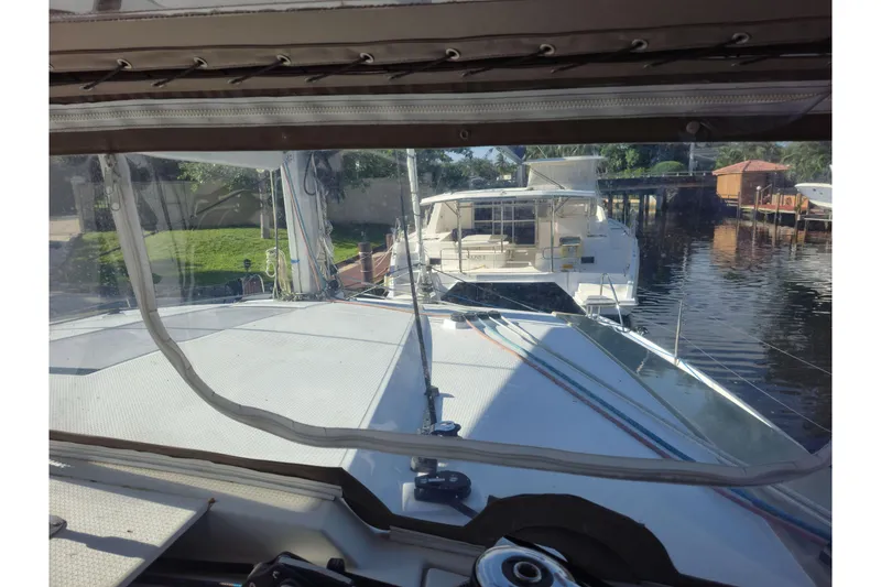 Slide: The Image of 2017 Fountaine Pajot Lucia 40 catamaran docked, viewed from the cockpit. - 27