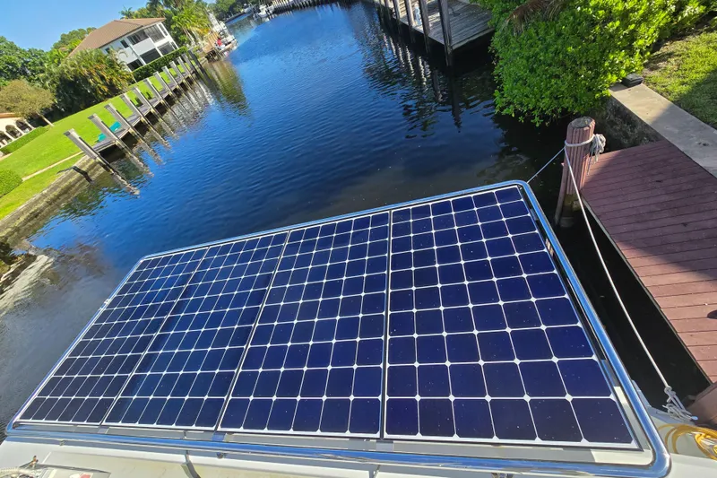 Slide: The Image of Solar panels on a 2017 Fountaine Pajot Lucia 40 catamaran by a scenic canal. - 31