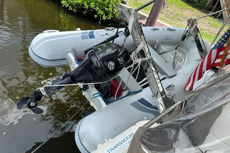 Slide: The Image of Inflatable boat with outboard motor docked beside 2017 Fountaine Pajot Lucia 40 catamaran. - 35