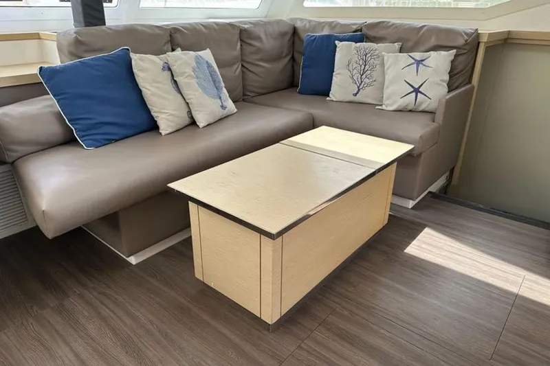 Slide: The Image of Luxurious interior of 2017 Fountaine Pajot Lucia 40 with cozy seating and decorative pillows. - 49