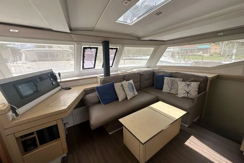 Slide: The Image of 2017 Fountaine Pajot Lucia 40 interior with cozy seating and navigation station. - 50