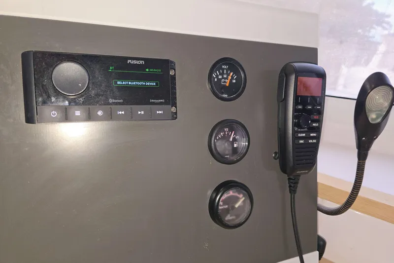 Slide: The Image of Control panel of a 2017 Fountaine Pajot Lucia 40 with gauges and communication devices. - 55