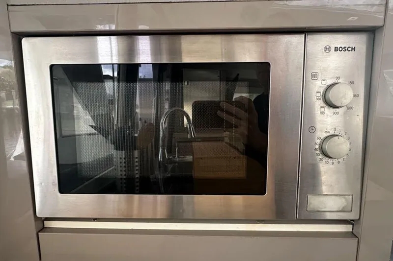 Slide: The Image of Built-in Bosch microwave oven with stainless steel finish on a Fountaine Pajot Lucia 40 yacht. - 60