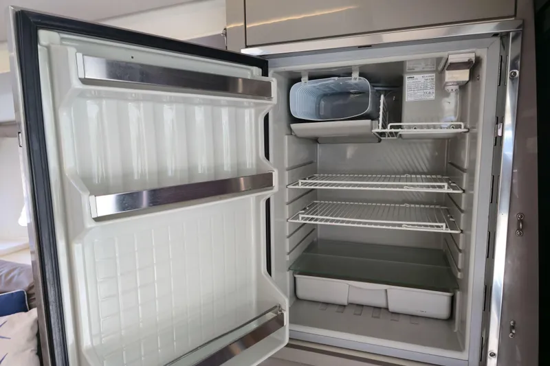 Slide: The Image of Open refrigerator inside 2017 Fountaine Pajot Lucia 40 catamaran, featuring empty shelves. - 65