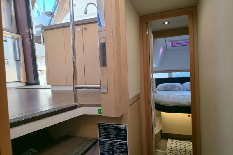Slide: The Image of Interior of 2017 Fountaine Pajot Lucia 40 catamaran, featuring a cozy bedroom and modern design. - 66