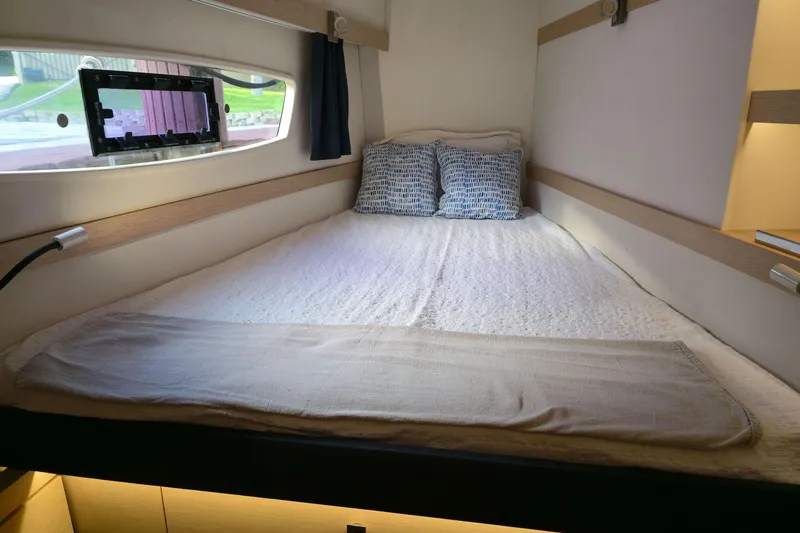 Slide: The Image of Cozy cabin interior of 2017 Fountaine Pajot Lucia 40 catamaran with double bed. - 74