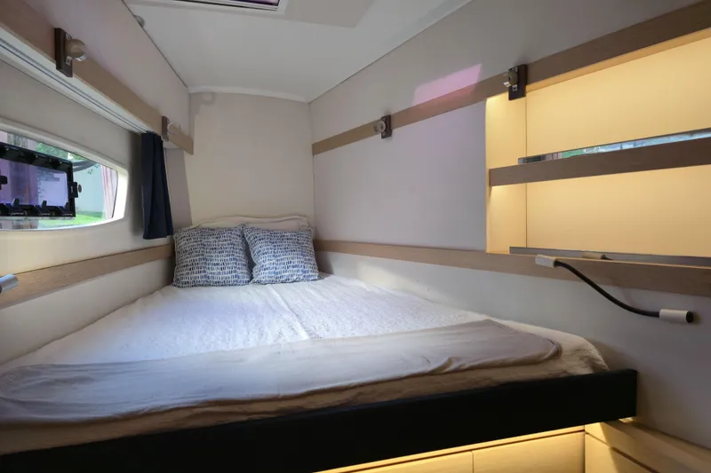Slide: The Image of Cozy cabin interior of 2017 Fountaine Pajot Lucia 40 catamaran with bed and window view. - 75