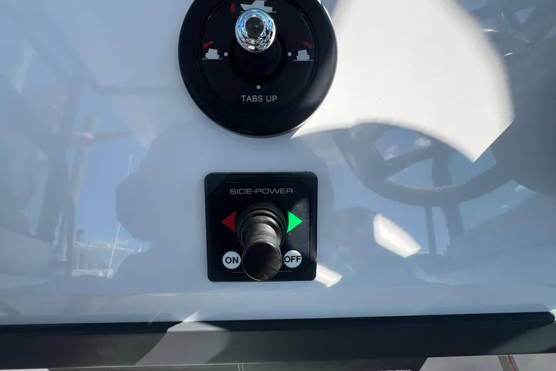 Slide: The Image of Control panel of a 2021 Axopar 28 boat with side-power switch. - 21