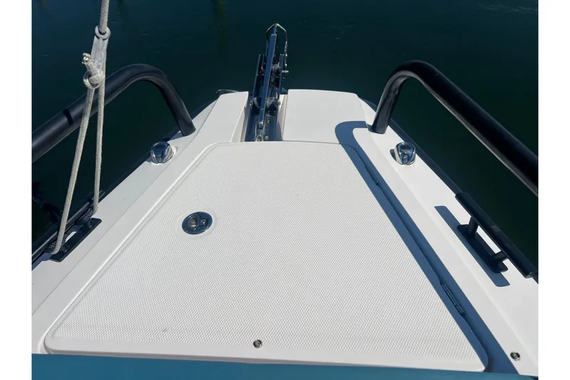 Slide: The Image of Bow of 2021 Axopar 28 boat with sleek design and sturdy railings. - 30