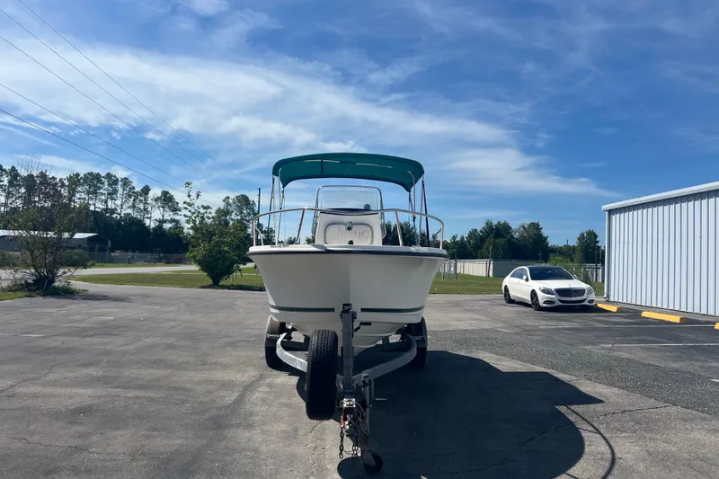 Slide: The Image of 2001 Trophy 1903 Center Console boat on trailer, parked outdoors under blue sky. - 3