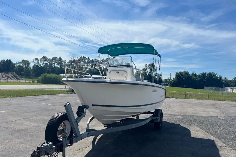 Slide: The Image of 2001 Trophy 1903 Center Console boat on trailer under blue sky. - 4