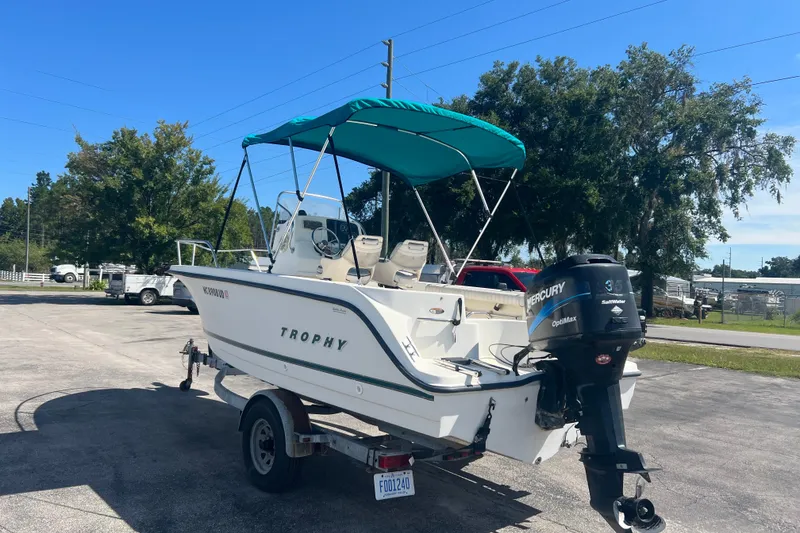 Slide: The Image of 2001 Trophy 1903 Center Console boat with Mercury engine on trailer. - 6