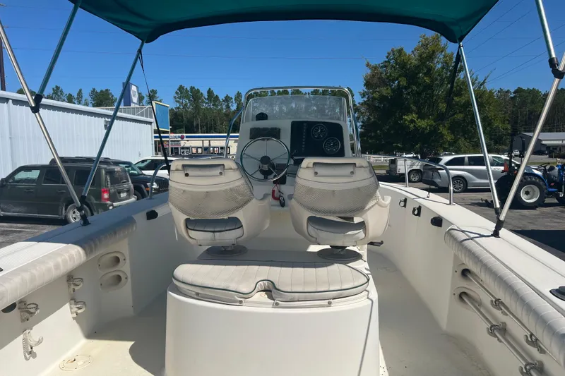 Slide: The Image of 2001 Trophy 1903 Center Console boat with seating and steering wheel under canopy. - 9