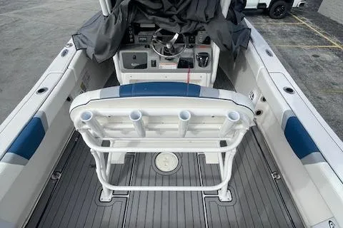 Slide: The Image of 2023 Robalo R230 Center Console boat interior with seating and steering console. - 10