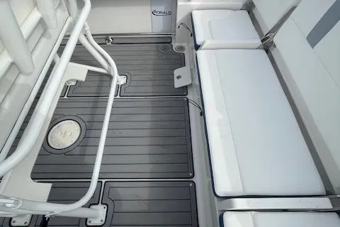 Slide: The Image of 2023 Robalo R230 Center Console boat interior with sleek seating and non-slip flooring. - 11