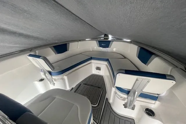 Slide: The Image of 2023 Robalo R230 Center Console boat interior with cushioned seating and sleek design. - 5