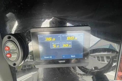 Slide: The Image of 2023 Robalo R230 Center Console dashboard with Yamaha display showing speed and trip data. - 9