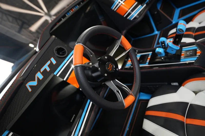 Slide: The Image of Interior of 2025 MTI 440X with vibrant steering wheel and modern controls. - 17