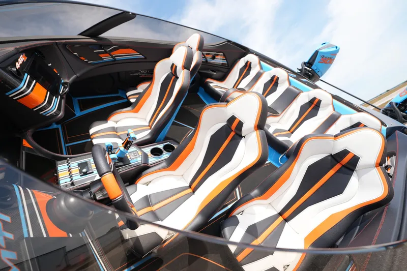 Slide: The Image of Interior of 2025 MTI 440X boat with sleek, modern seating design. - 19