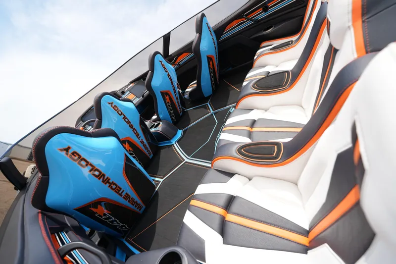 Slide: The Image of Interior of 2025 MTI 440X with vibrant blue and orange seating design. - 20