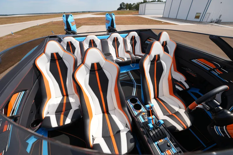 Slide: The Image of Interior of 2025 MTI 440X boat with sporty, colorful seating design. - 26