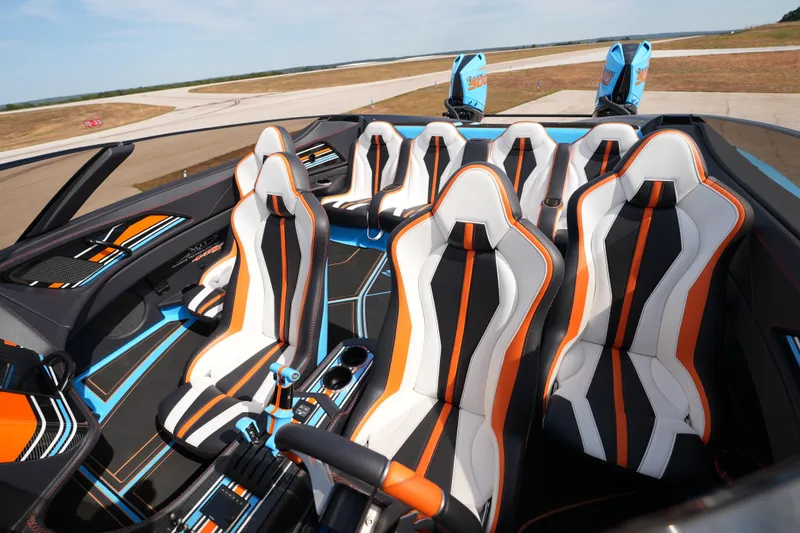 Slide: The Image of Interior of 2025 MTI 440X with sleek, modern design and vibrant orange accents. - 27