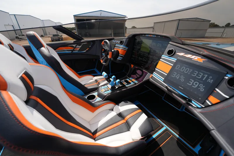 Slide: The Image of Interior of 2025 MTI 440X with modern dashboard and sporty seats. - 29