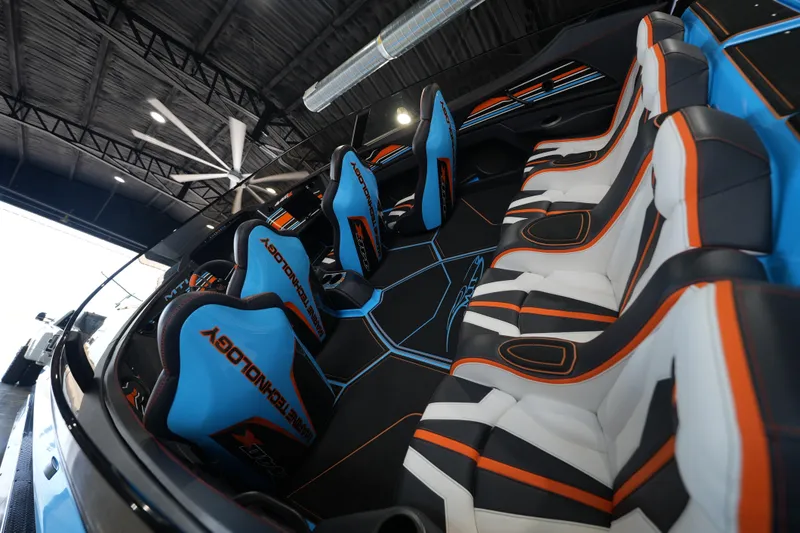 Slide: The Image of Interior of 2025 MTI 440X with modern blue and orange seating design. - 3
