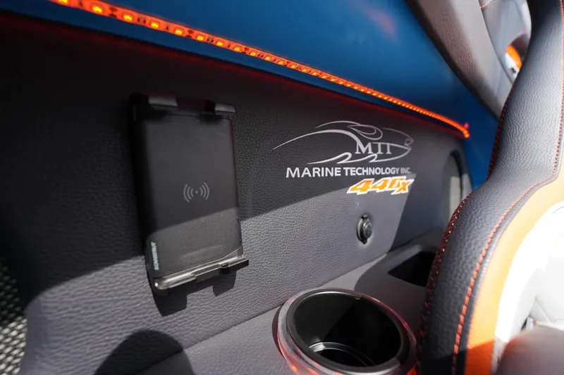 Slide: The Image of Interior of 2025 MTI 440X boat with logo and phone holder. - 39