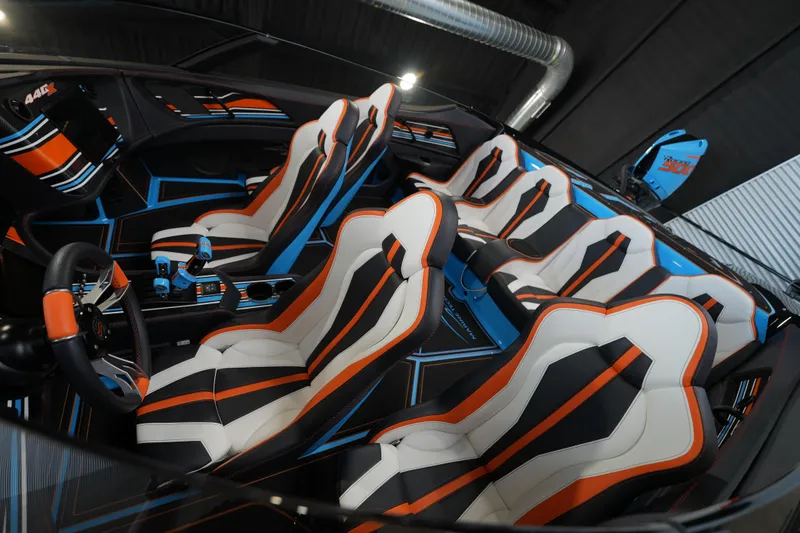 Slide: The Image of Interior of 2025 MTI 440X with vibrant, futuristic seat design and color scheme. - 4