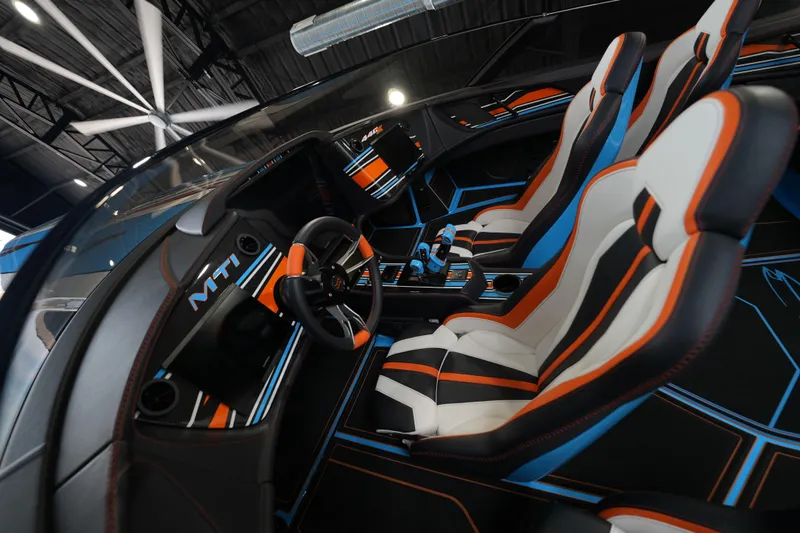 Slide: The Image of Interior of 2025 MTI 440X with sleek, modern design and vibrant orange accents. - 5