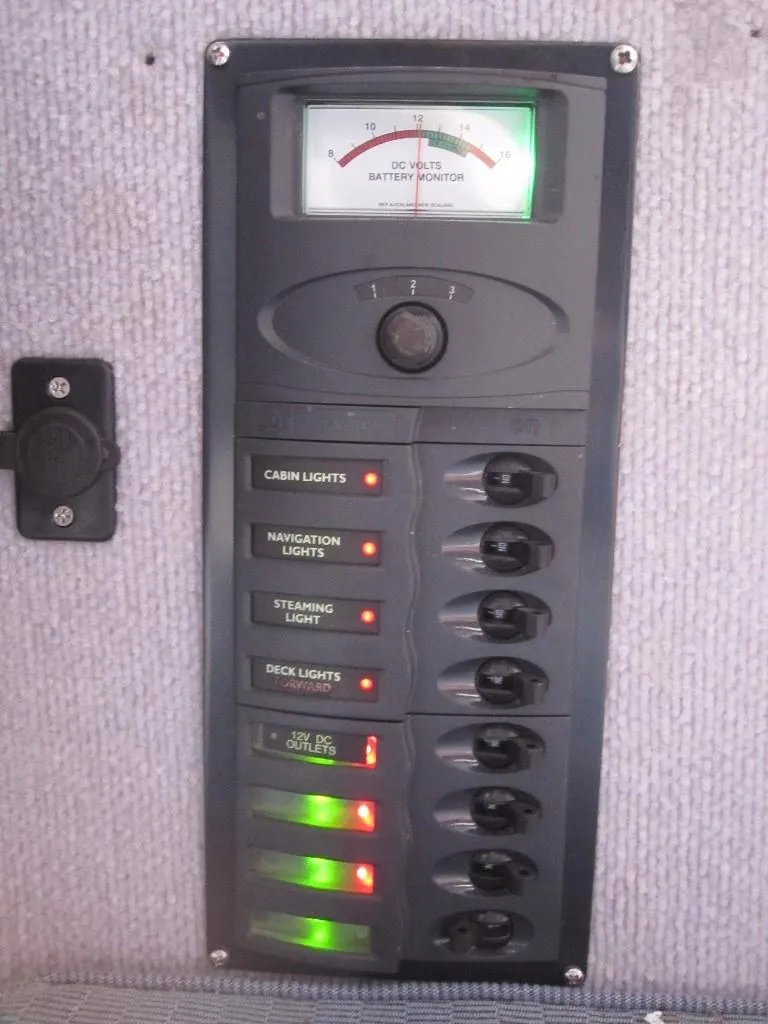 Slide: The Image of Control panel of a 2010 Corsair Dash 750 with labeled switches and battery meter. - 11