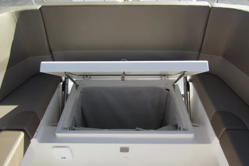 Slide: The Image of Open storage compartment on Nimbus Tender 9 boat, 2025 model, with cushioned seating. - 38