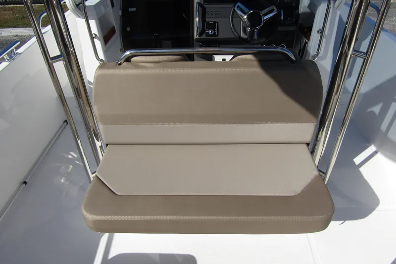 Slide: The Image of 2025 Nimbus Tender 9 boat seat with beige upholstery and stainless steel frame. - 40