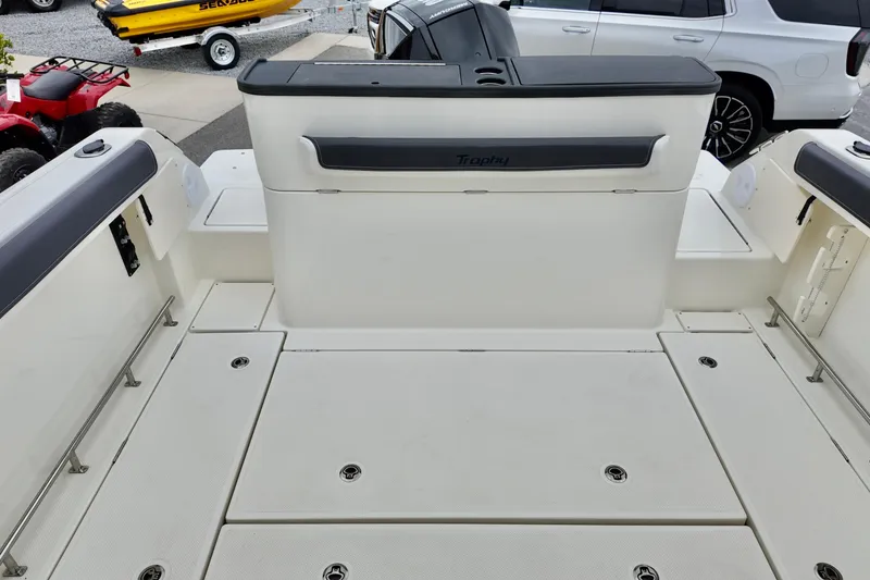 Slide: The Image of 2026 Bayliner Trophy T25 Pilothouse boat deck, featuring spacious seating and storage. - 24