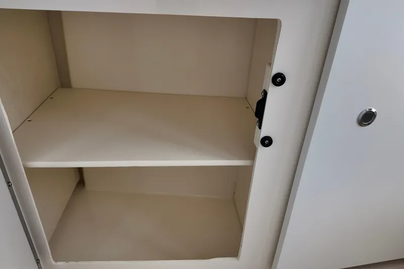 Slide: The Image of Empty storage compartment in 2026 Bayliner Trophy T25 Pilothouse boat. - 25