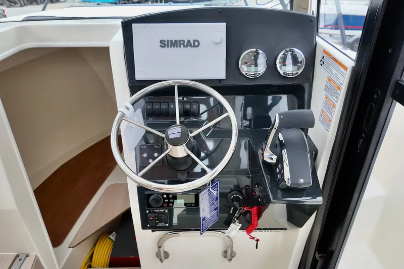 Slide: The Image of 2026 Bayliner Trophy T25 Pilothouse helm with Simrad navigation system. - 29