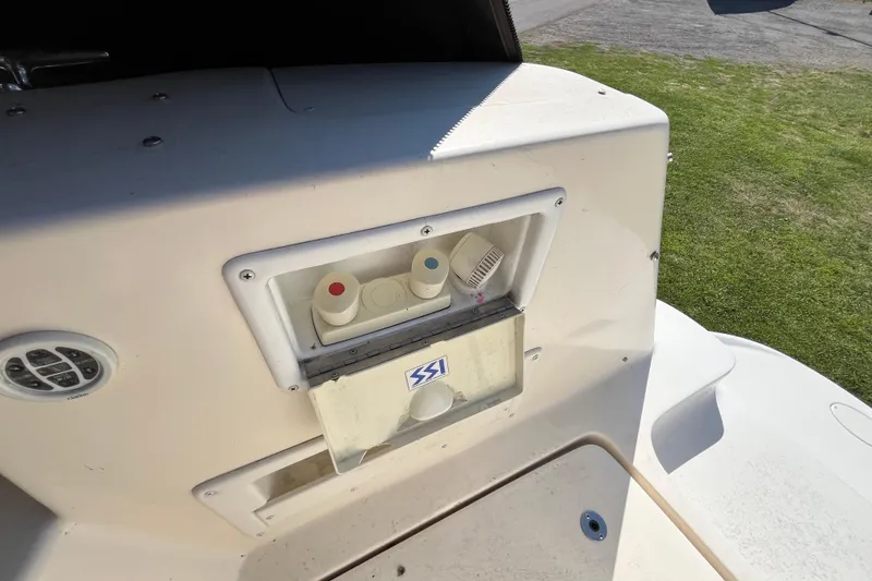 Slide: The Image of 2000 Rinker 340 Fiesta Vee boat deck with shower controls and speaker. - 10
