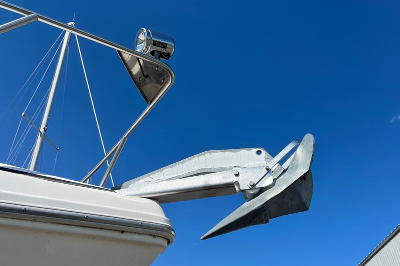 Slide: The Image of Bow of 2000 Rinker 340 Fiesta Vee with anchor against clear blue sky. - 2