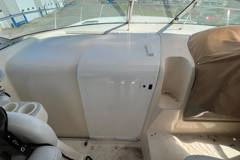 Slide: The Image of 2000 Rinker 340 Fiesta Vee boat interior with seating and storage compartments. - 25