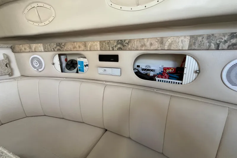 Slide: The Image of Interior of 2000 Rinker 340 Fiesta Vee boat with seating and storage compartments. - 31