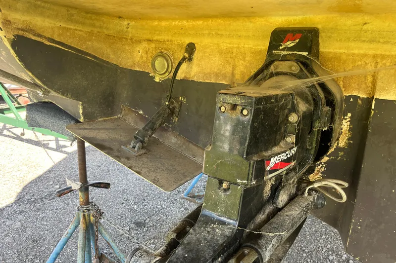 Slide: The Image of Close-up of 2000 Rinker 340 Fiesta Vee boat's Mercury outdrive and trim tab. - 4