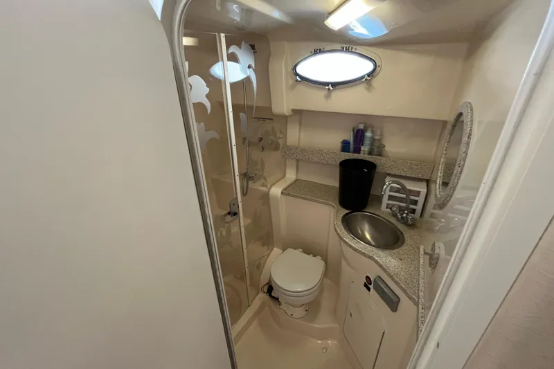 Slide: The Image of 2000 Rinker 340 Fiesta Vee boat bathroom with sink, toilet, and shower. - 46