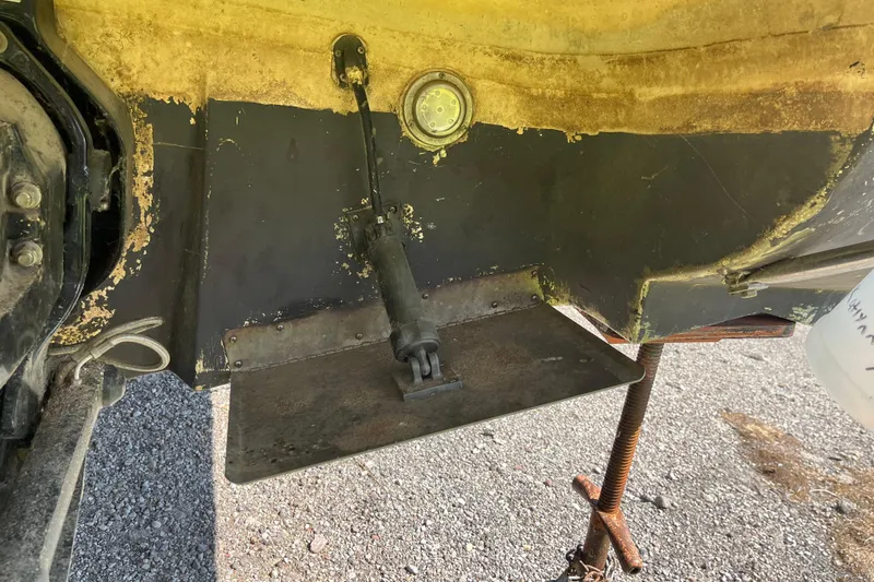 Slide: The Image of Close-up of a 2000 Rinker 340 Fiesta Vee boat's trim tab and hydraulic system. - 5